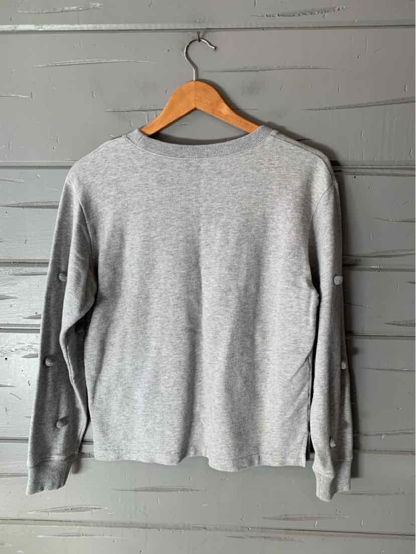 Gray J.Crew long-sleeve crewneck shirt with a relaxed fit and straight hem, hanging on a wooden hanger.