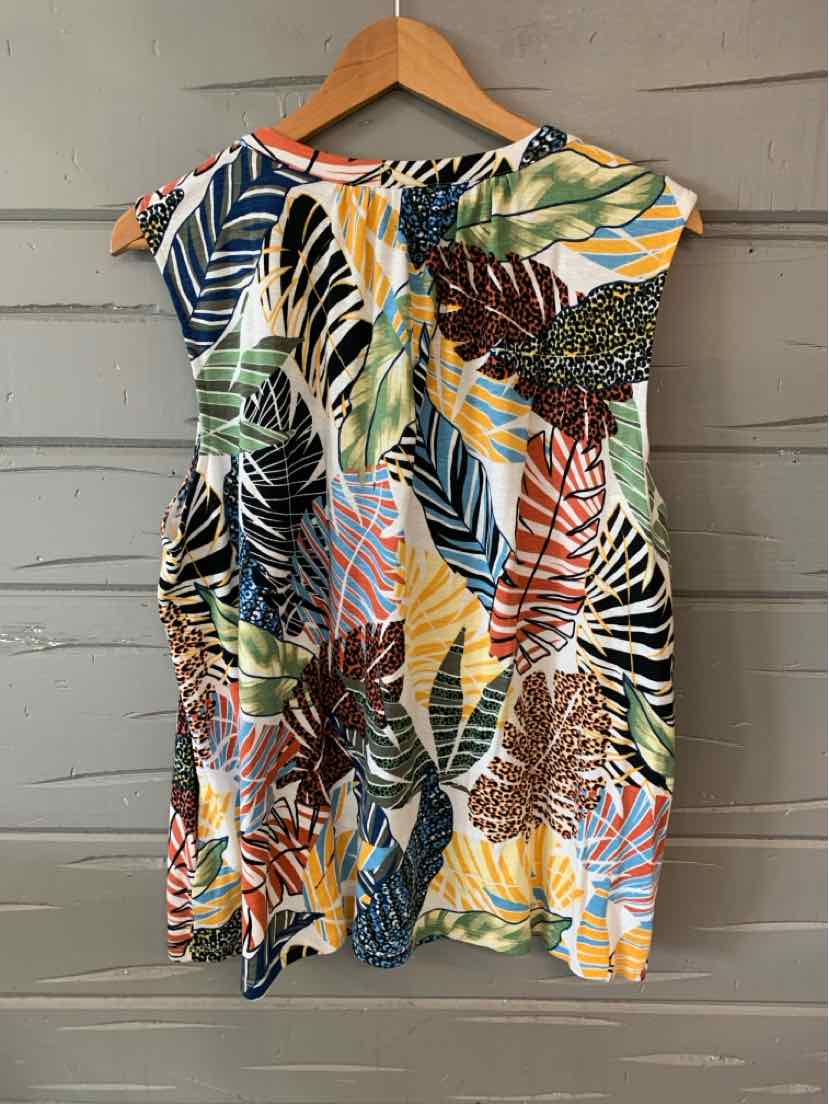 Sleeveless tropical print dress with multicolor leaves in blue, green, orange, and yellow on white background.