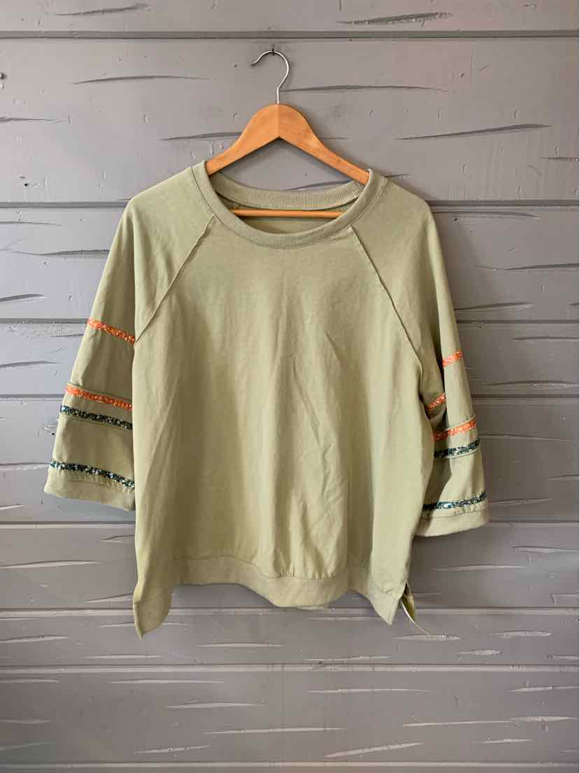 Light olive green loose-fit sweatshirt with wide sleeves featuring orange and black stripe details.
