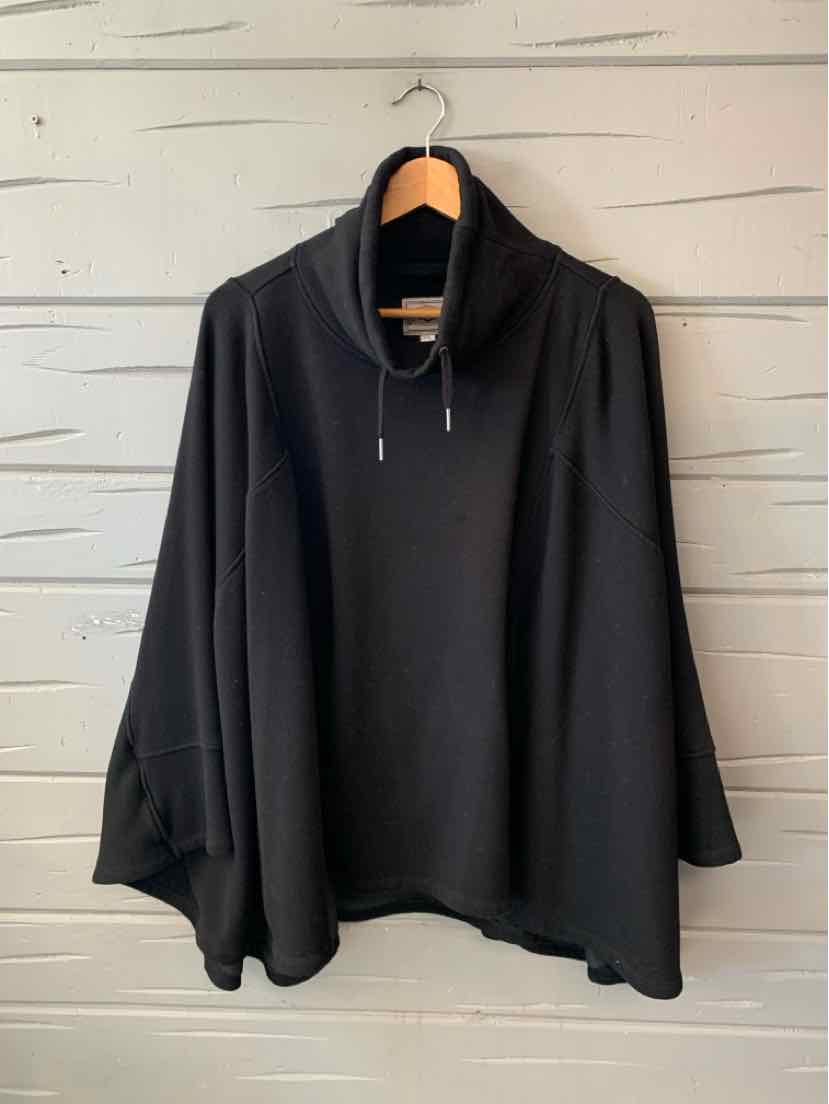 Black UGG poncho-style pullover with a loose fit, draped sleeves, and a short front zipper.