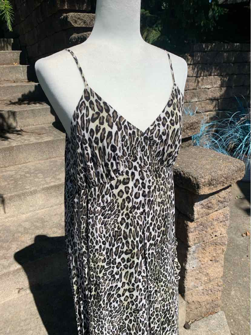 Sleeveless leopard print slip dress with thin spaghetti straps and V-neckline.