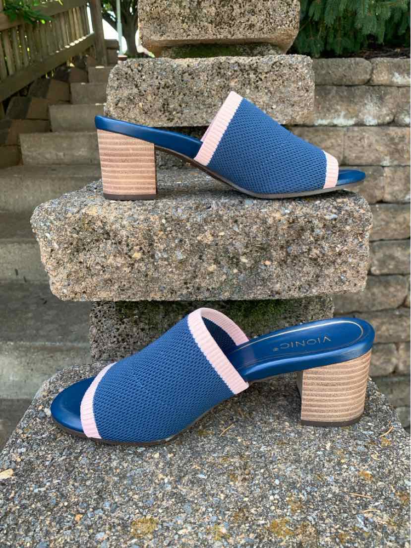 Blue open-toe slide sandal with pink trim, cushioned footbed, and stacked wooden block heel.