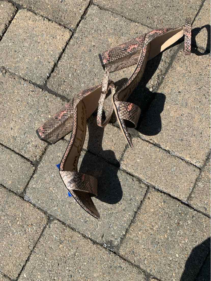 Multi-color lizard print high-heeled sandal with ankle strap and buckle, size 10.
