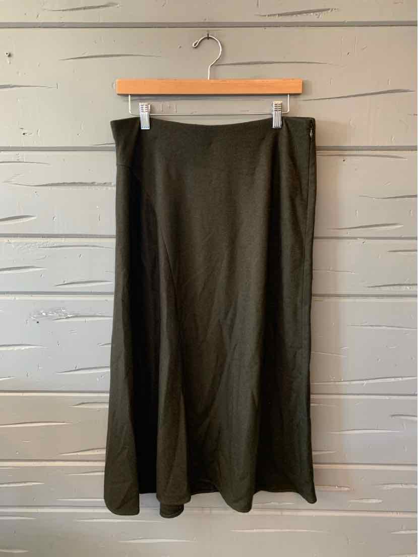 Dark gray Vince maxi skirt with a straight silhouette, subtle sheen, and long flowing hem, hanging on a wooden clip hanger.
