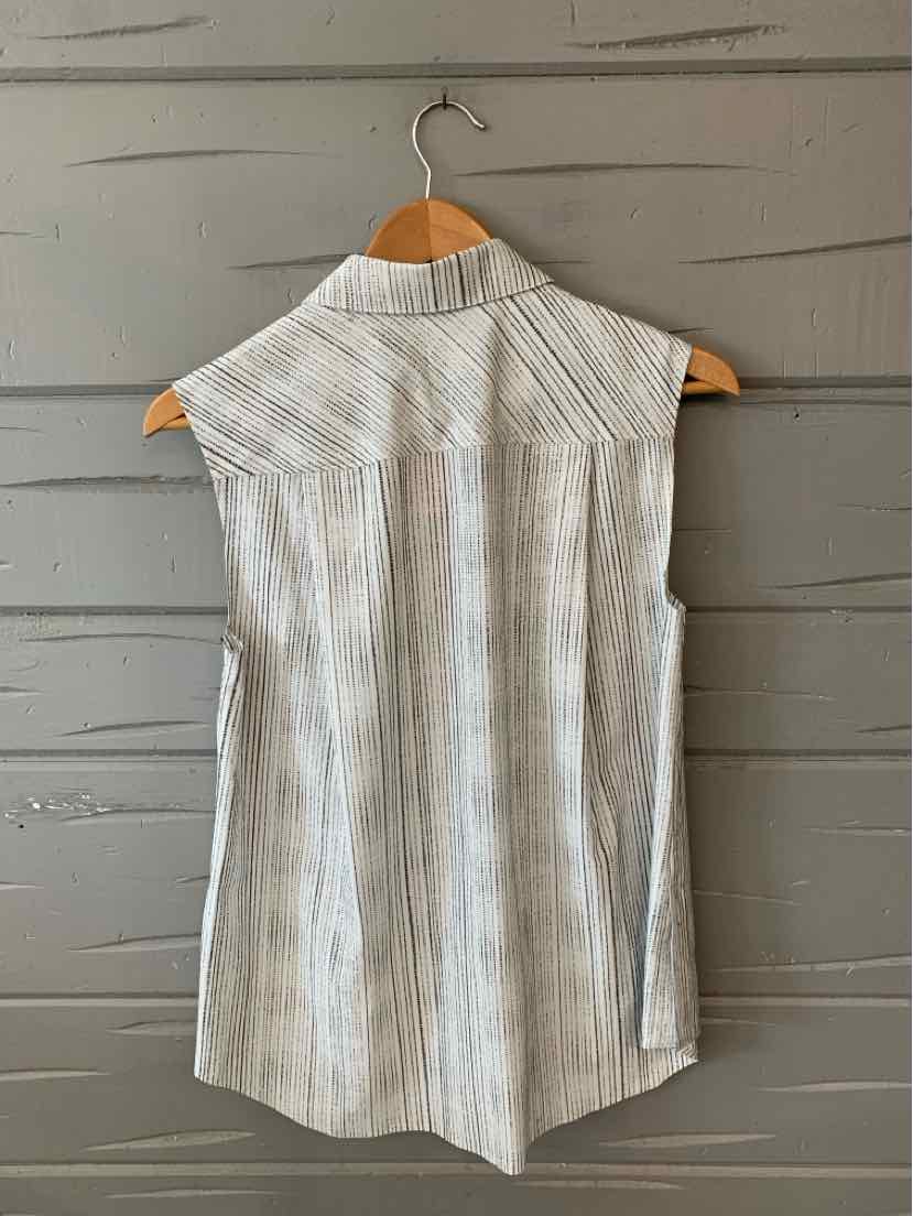 White sleeveless blouse with vertical thin gray stripes and a collar on a wooden hanger.