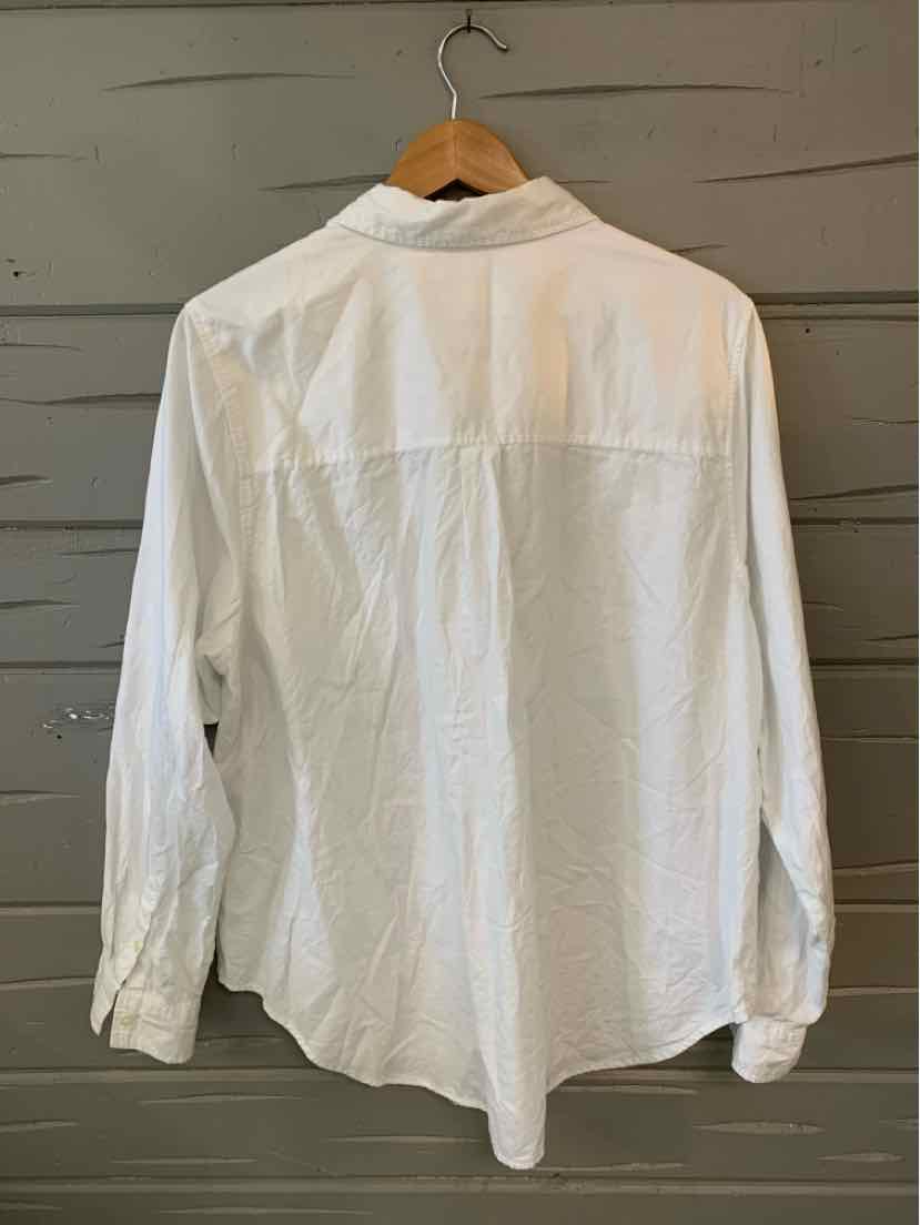 White long-sleeve button-up shirt with collar, displayed on hanger, back view.