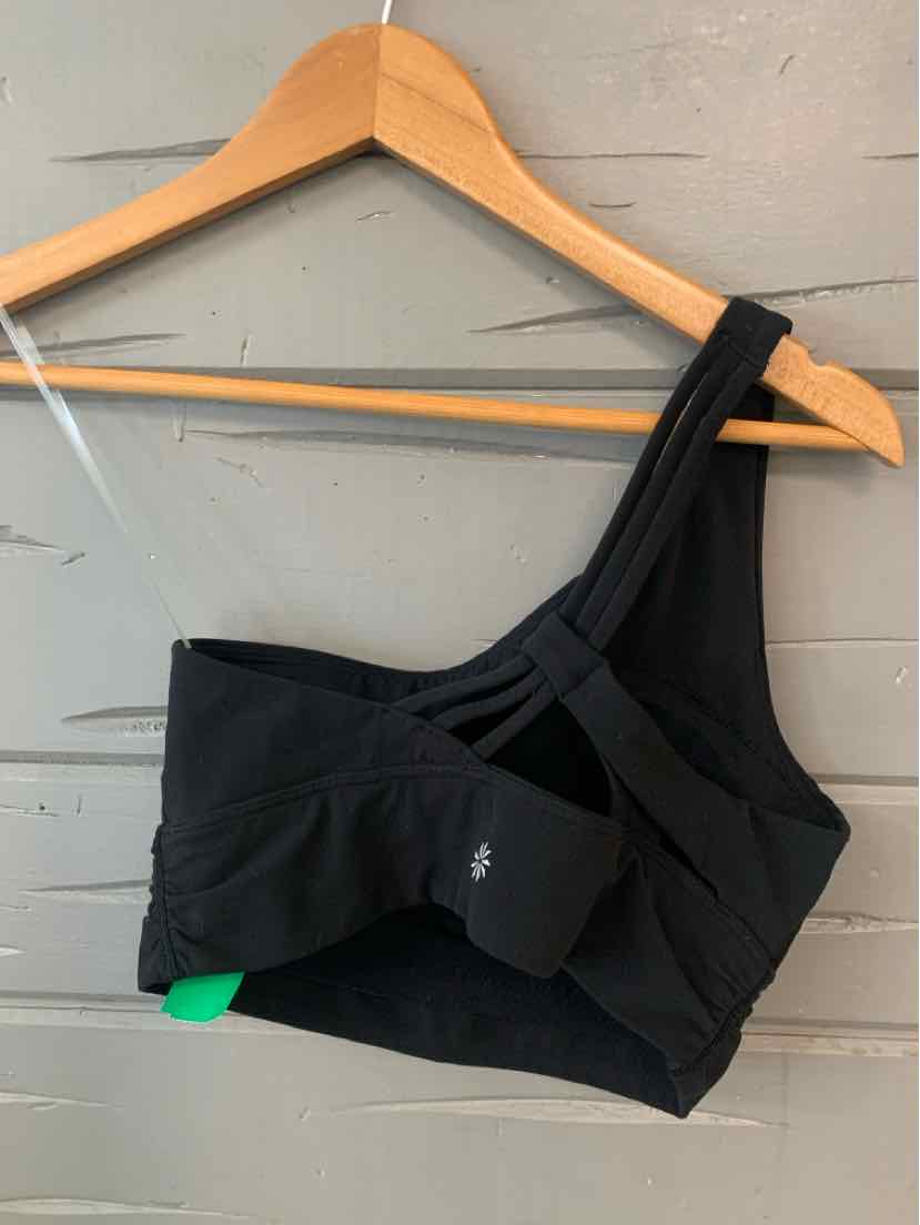 Black asymmetrical sports bra with double shoulder straps and a small logo on front band.