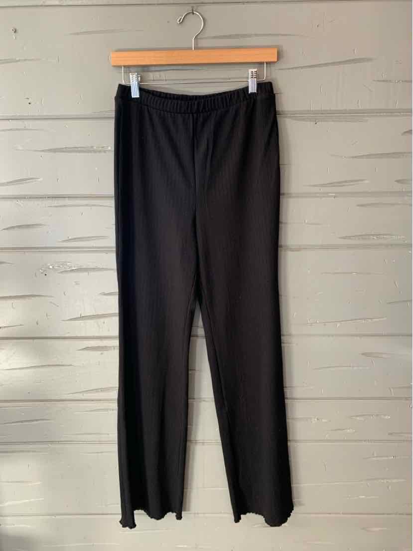 Black solid women’s pants with an elastic waistband and straight, relaxed legs.