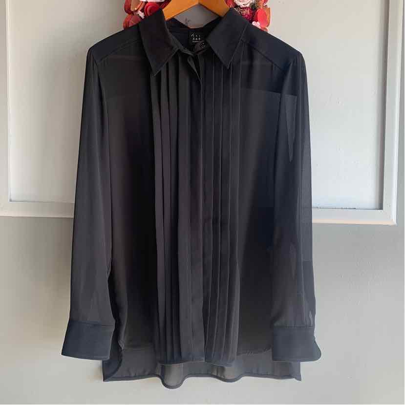 Black long-sleeve blouse with pleated front and classic collar hanging on wooden hanger.