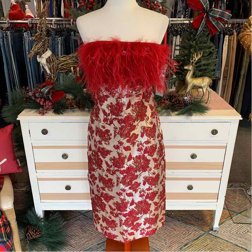 Red jacquard strapless dress with floral pattern and red feather trim at the bust, knee-length silhouette.