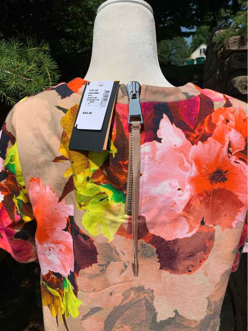 Floral multi-color dress with prominent orange, pink, and green flowers and a visible silver back zipper.