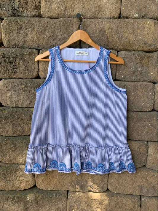 Blue and white striped sleeveless blouse with ruffled hem and decorative blue embroidery detail.