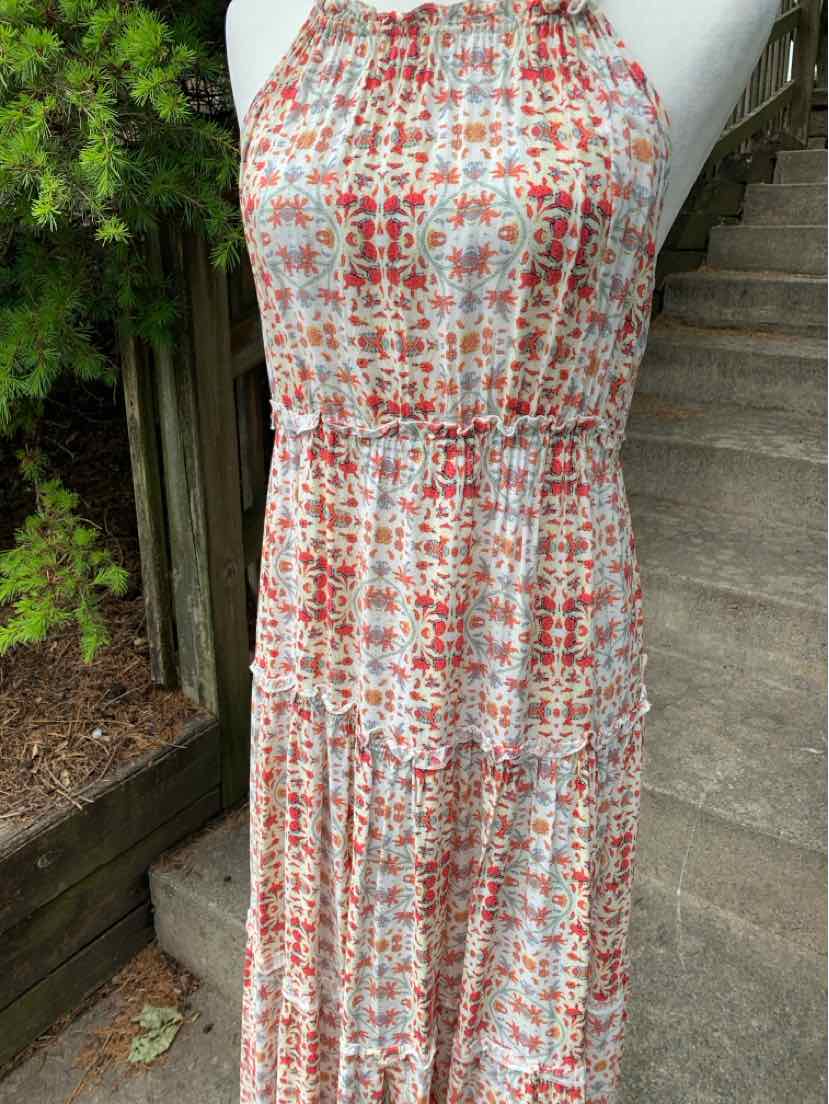Sleeveless floral midi dress in pink and orange with gathered waist and high neckline.