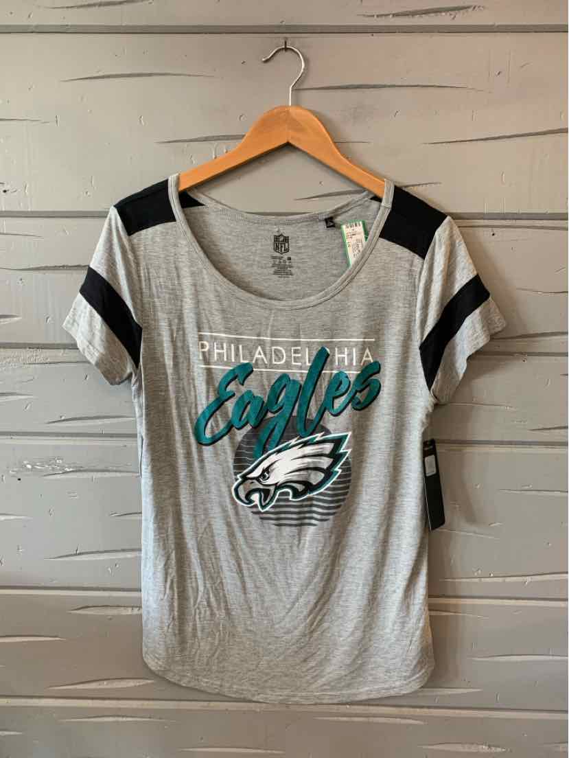 Gray short-sleeve Philadelphia Eagles t-shirt with black shoulder stripes and teal team logo on front.