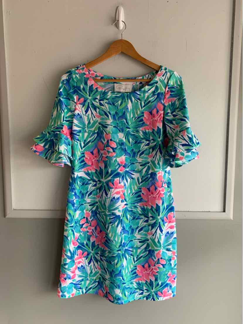 Teal floral dress with pink and green leaf print, short ruffled sleeves, and a relaxed fit.