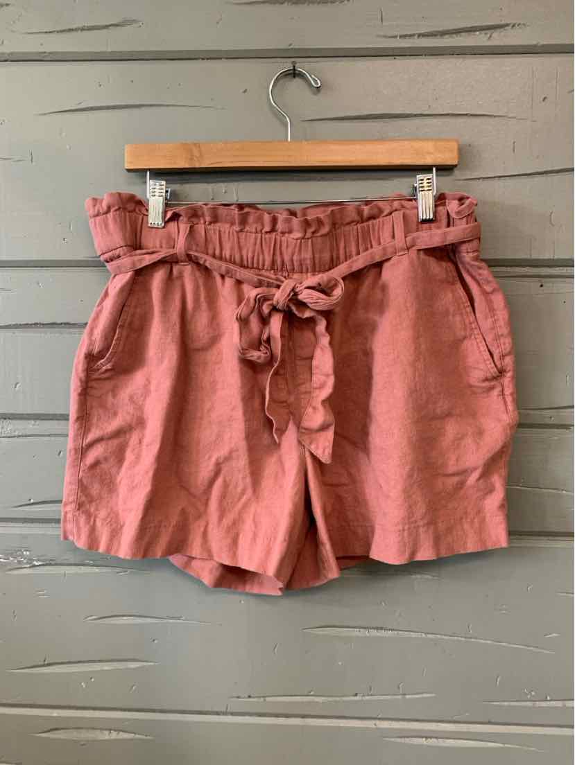 Rust-colored paperbag waist shorts with a tied front belt and side pockets in size 14.