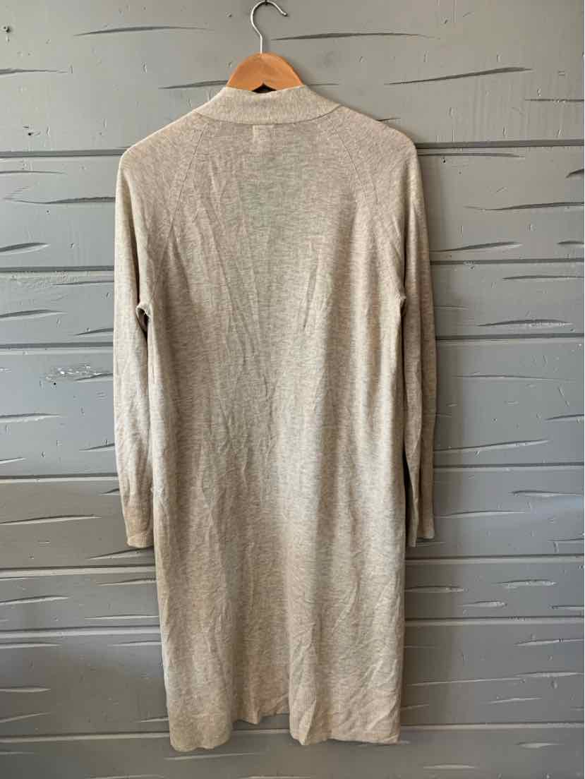 Beige long-sleeve knit cardigan with a straight hem, medium size, hanging on wooden hanger.