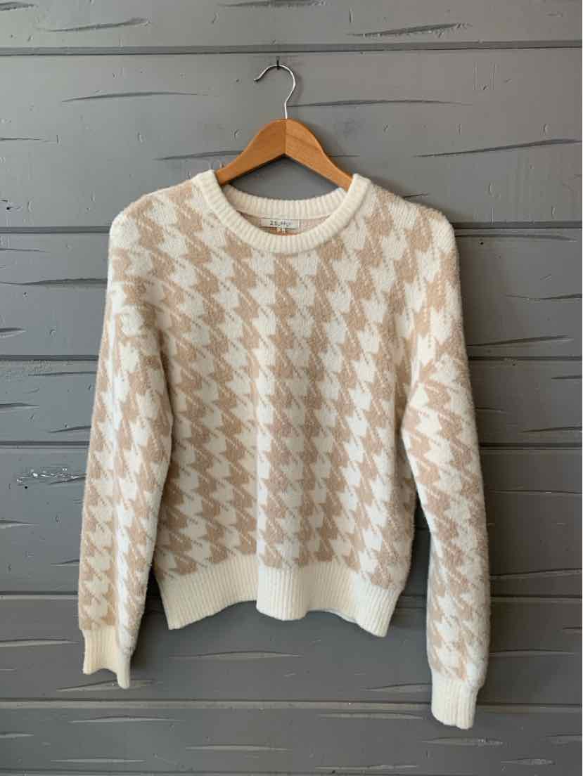 Tan and cream houndstooth knit sweater with ribbed cuffs, hem, and crew neckline.