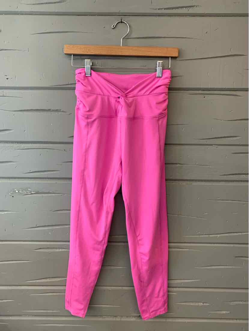 Pink high-waisted leggings with ruched waistband and slim fit design.
