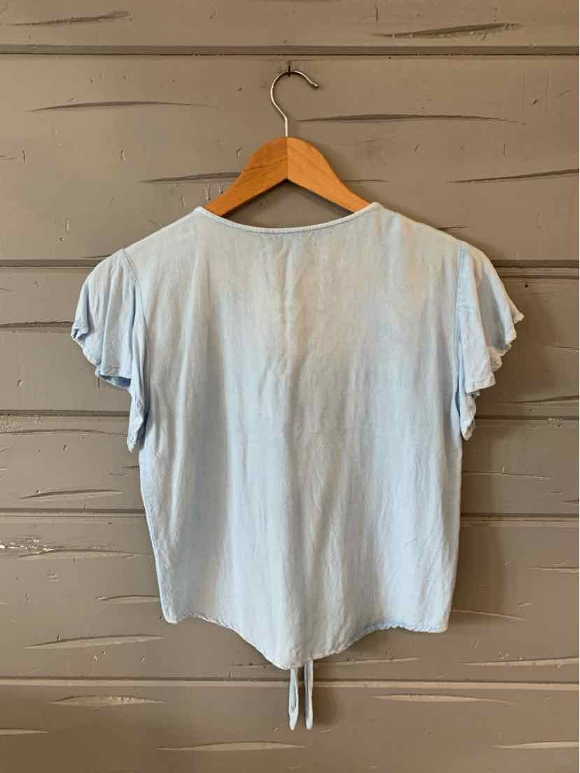 Light blue short-sleeve top with ruffled sleeves and a tie detail at the back hem.