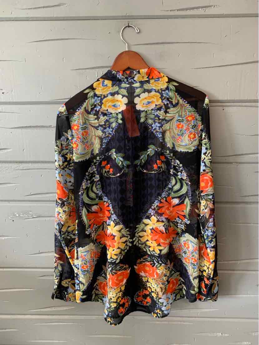 Black floral blouse with long sleeves, high neck, and vibrant orange and yellow flower patterns.