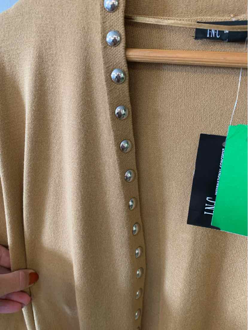 Tan knit cardigan with shiny silver snap buttons and size XL tag visible.