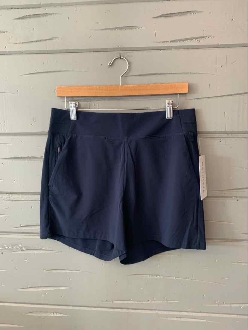 Navy blue athletic shorts with side zipper pockets and wide waistband, size 10.