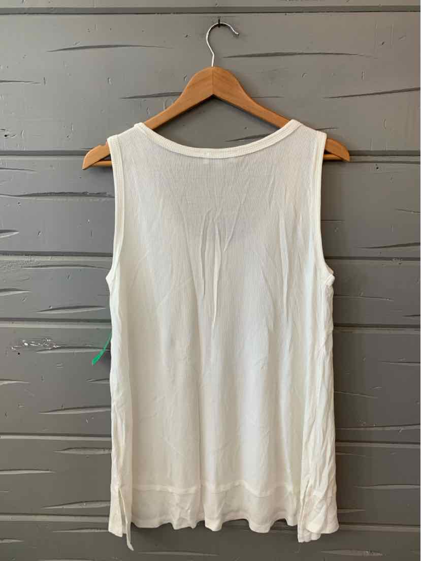 White sleeveless flowy tank top with textured fabric and scalloped hem, size large.