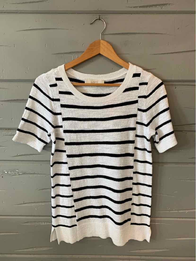 White short-sleeve knit top with black horizontal stripes and a ribbed crew neckline.
