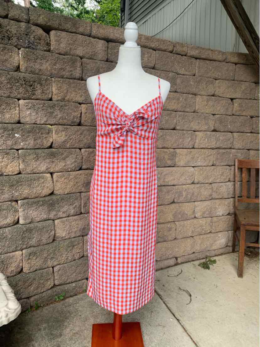 Red and white gingham sleeveless dress with twist knot front and midi length.