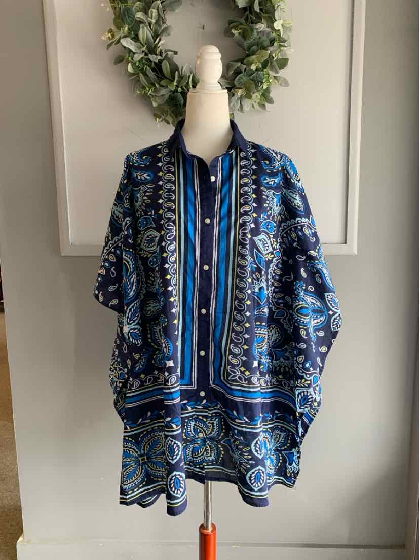 Blue paisley patterned women's tunic with button-down front and loose fit on mannequin.