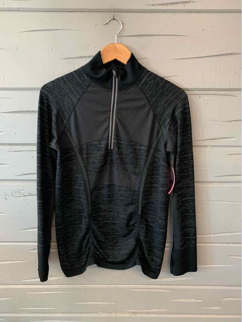 Black quarter-zip athletic pullover with subtle striped pattern and long sleeves on wooden hanger.