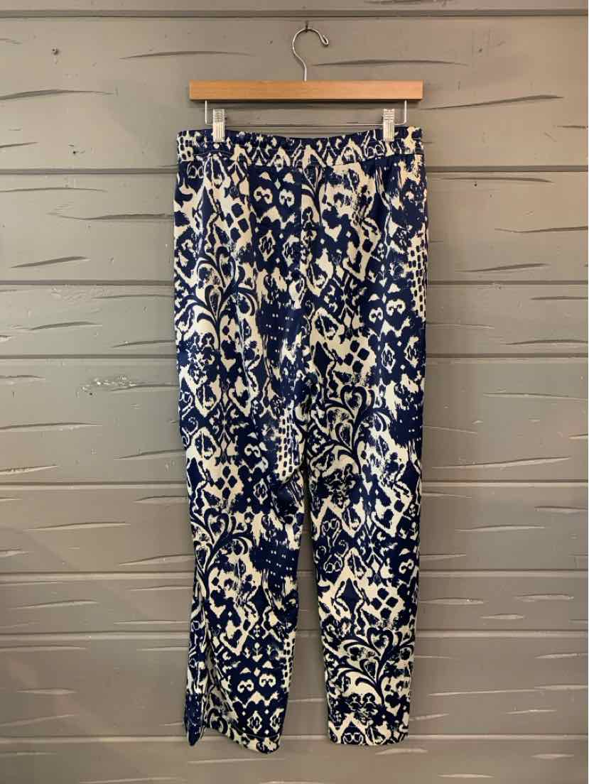 Navy and white patterned lightweight pants with elastic waistband and tapered legs in medium size.