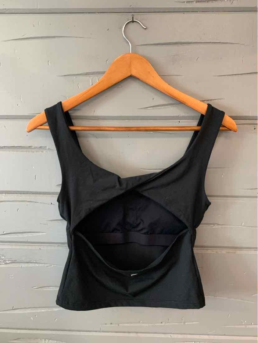 Black sleeveless crop top with wide straps and an open back cutout, fitted style.