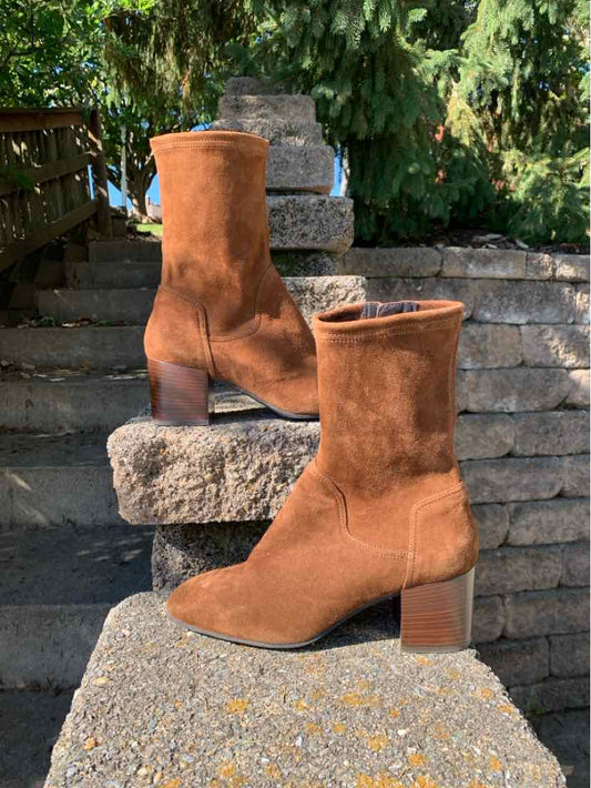 Brown suede ankle boots with rounded toes, side zippers, and chunky stacked block heels.