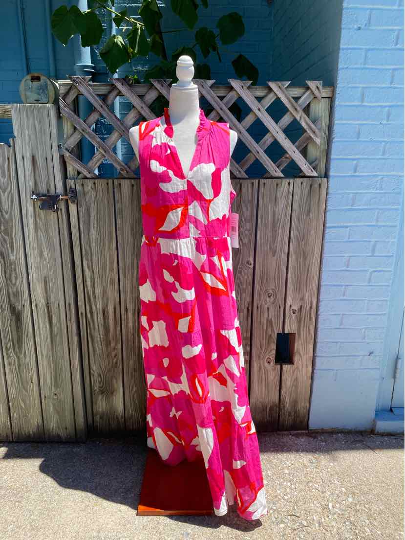 Sleeveless pink maxi dress with bold abstract floral print and V-neckline on white mannequin.