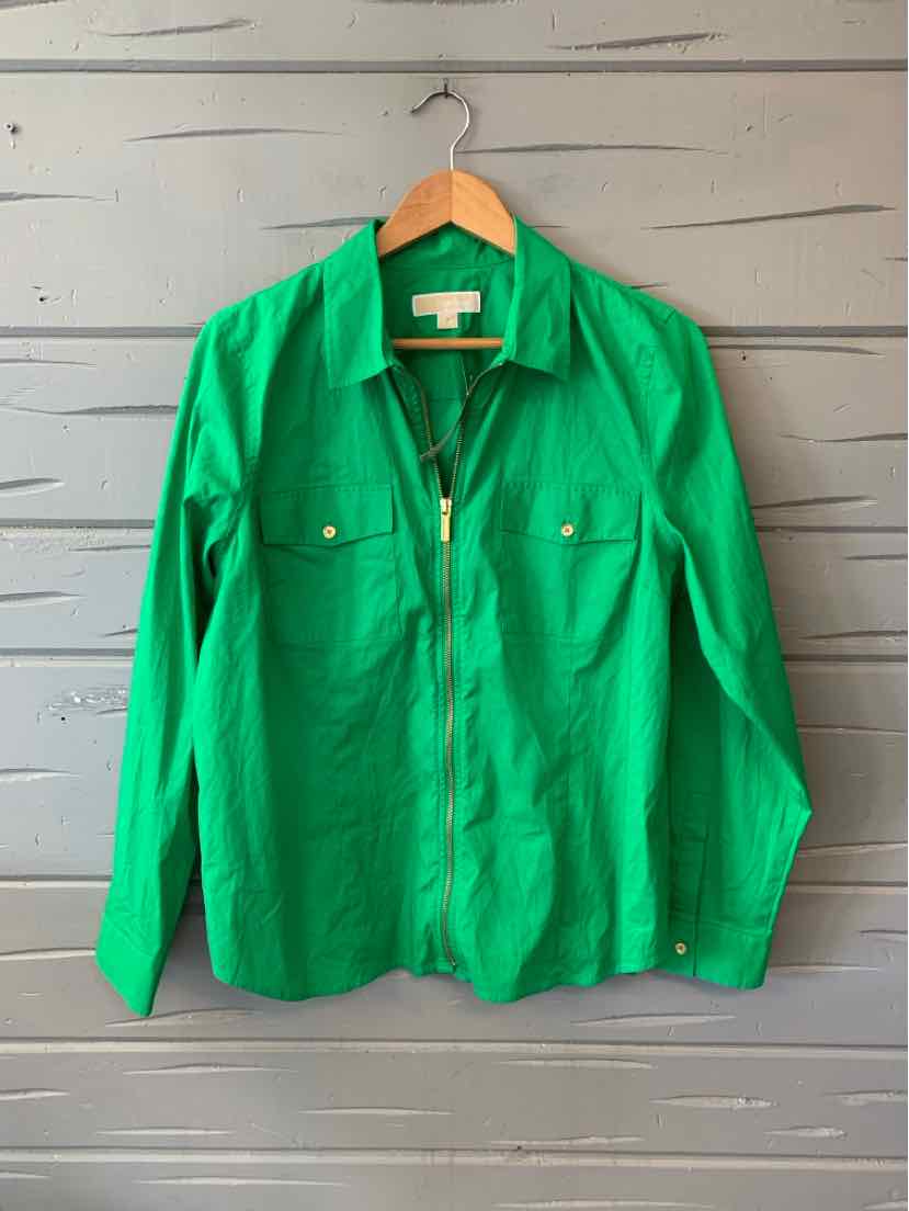 Green long-sleeve button-up shirt with collar and two chest pockets on wooden hanger.