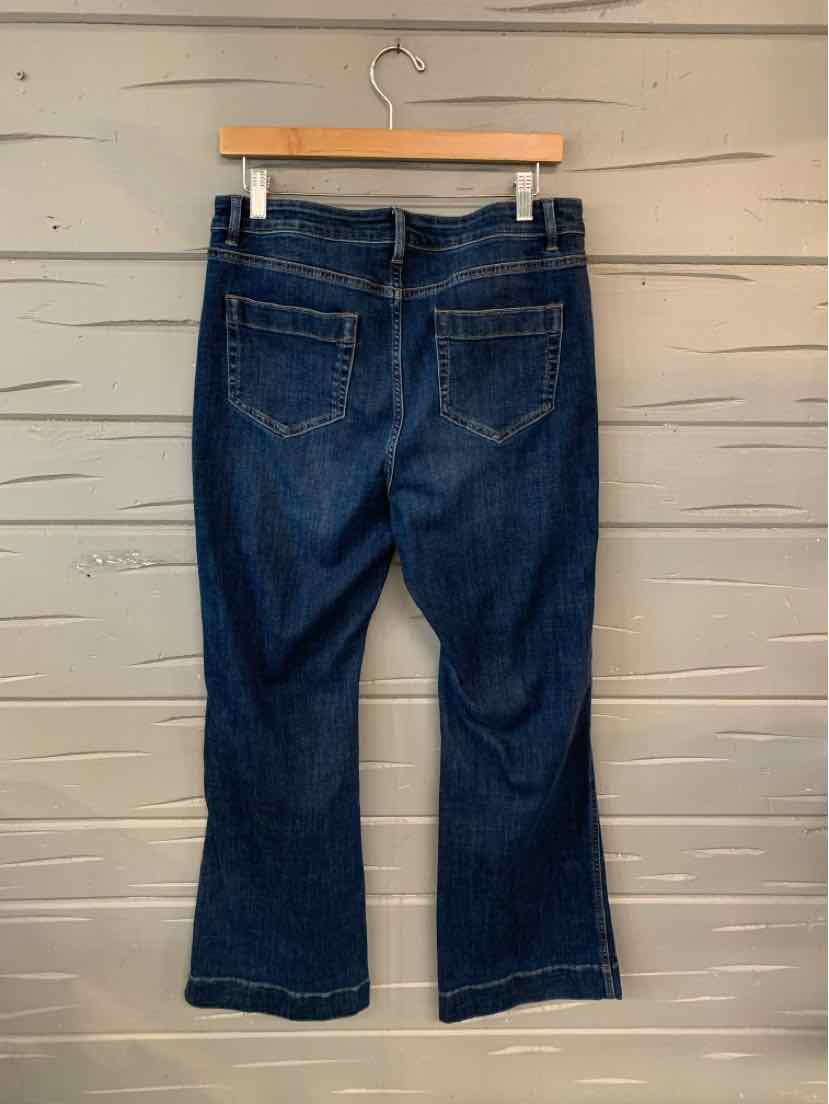 Dark blue bootcut jeans with back pockets and belt loops, size 10, hanging on wooden hanger.