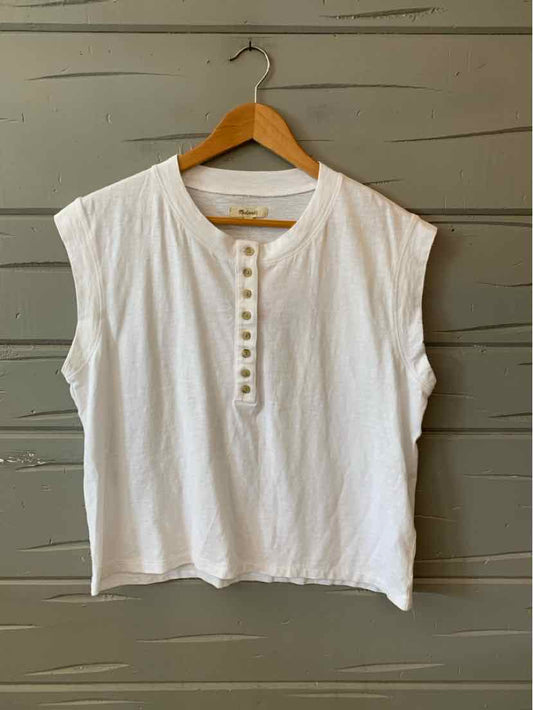 White sleeveless cotton henley shirt with button placket and relaxed fit, size medium.