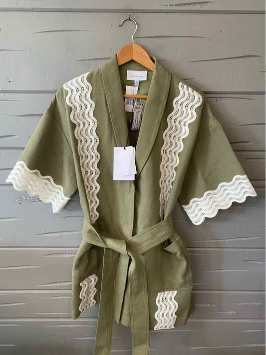 Olive green kimono robe with white wavy trim on sleeves, front edges, and pockets, belted waist, mid-length.