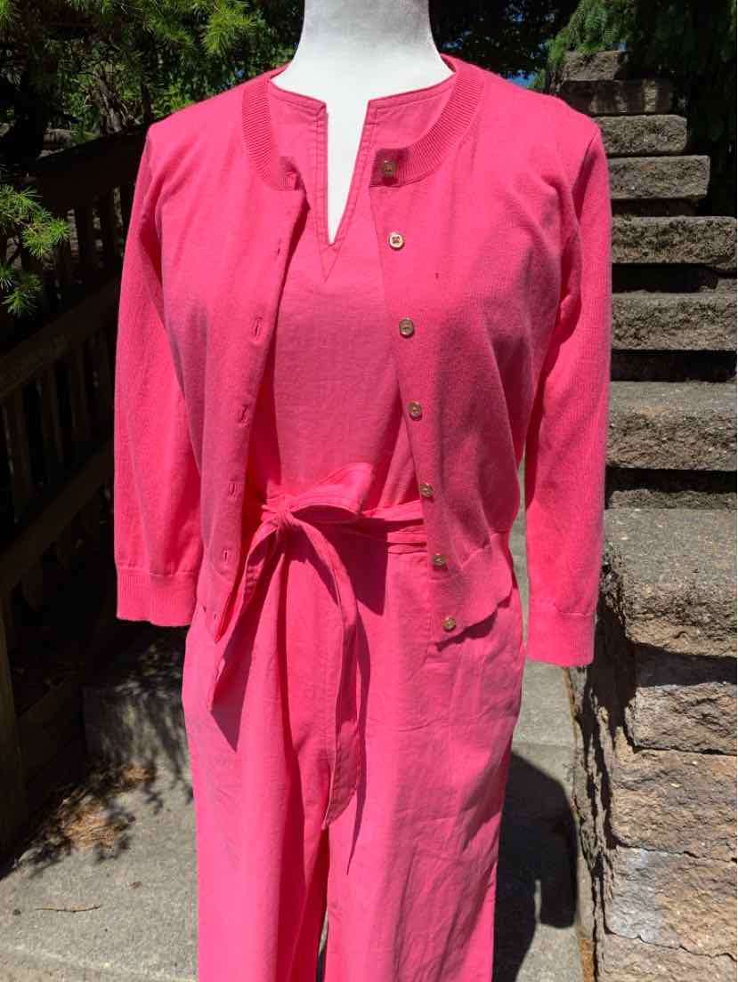 Pink long-sleeve jumpsuit with button front and matching belt in size small.