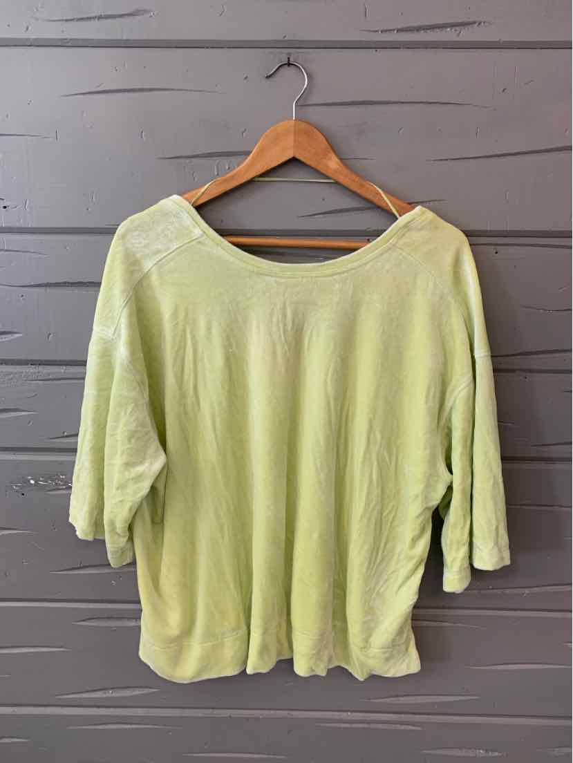 Light green loose-fit short-sleeve top with wide scoop neck, soft fabric.
