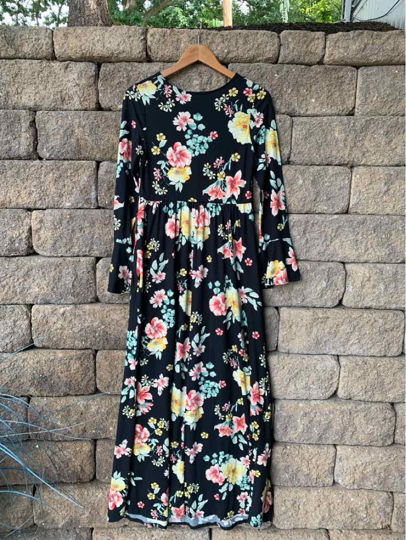 Black long-sleeve midi dress with colorful floral print and gathered waist.
