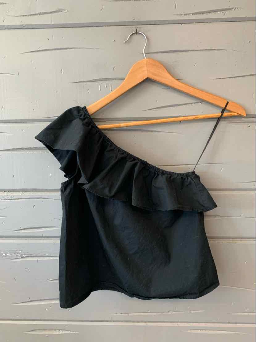 Black one-shoulder sleeveless top with ruffled neckline on wooden hanger.