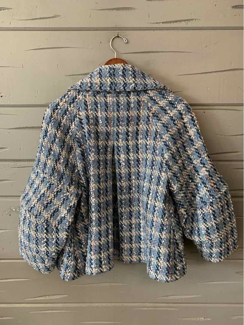 Blue and white tweed women’s jacket with voluminous sleeves and loose fit, size small.