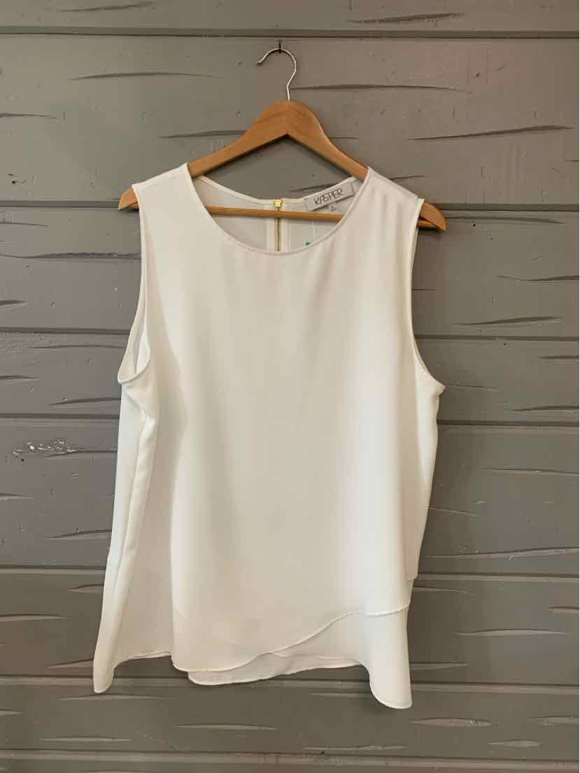 White sleeveless blouse with round neckline and slight high-low hem on wooden hanger.