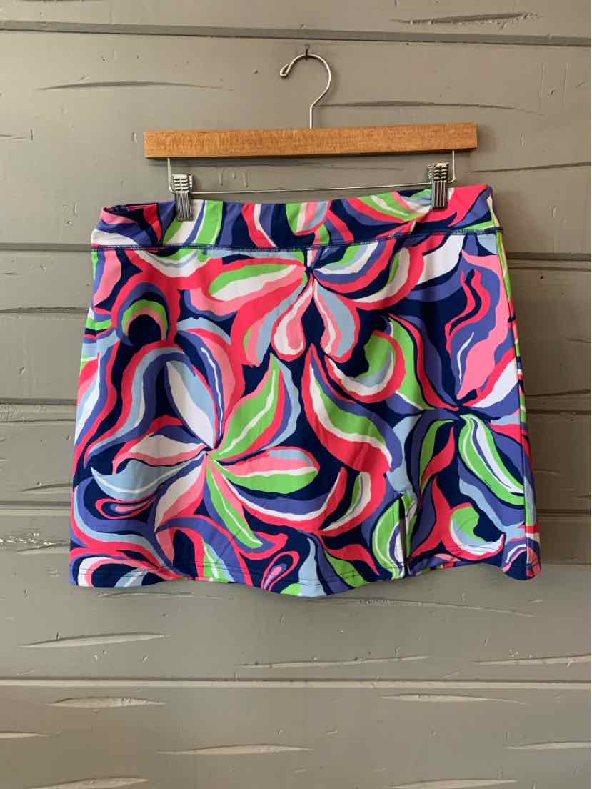 Colorful floral print skirt in large size with shades of pink, blue, green, and white on a navy background.