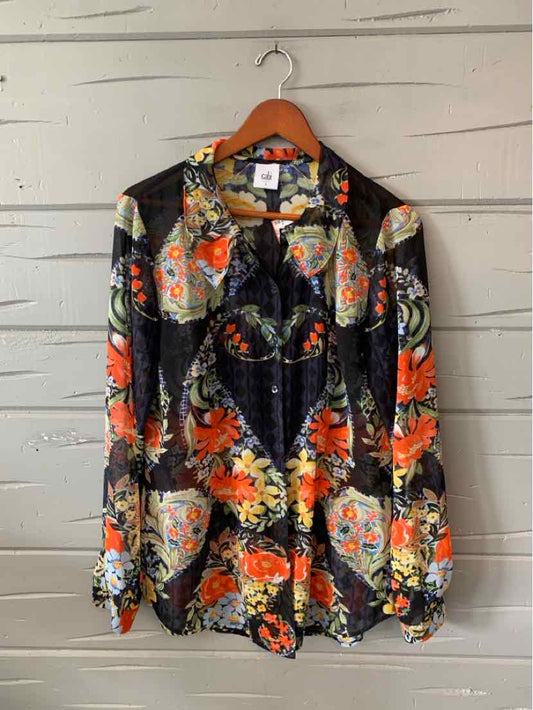 Black long-sleeve blouse with vibrant orange, yellow, and white floral print and button-down front.