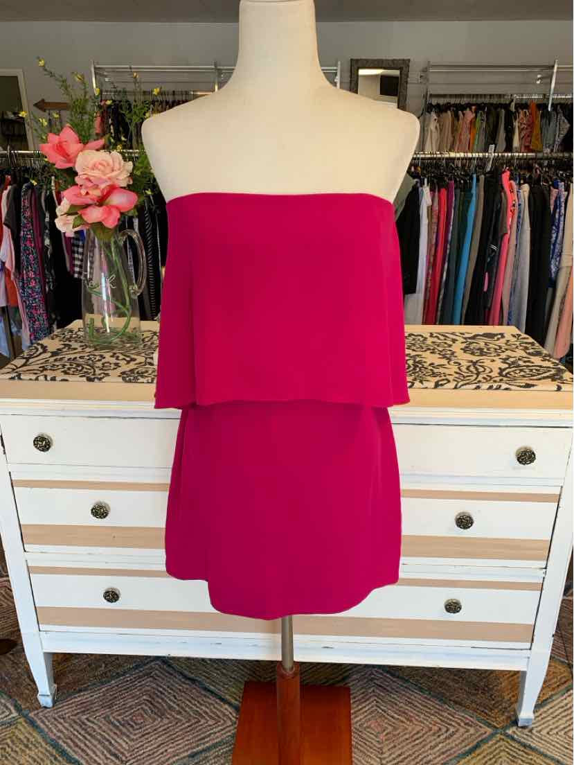 Strapless fuchsia mini dress with layered bodice and straight hem on mannequin.