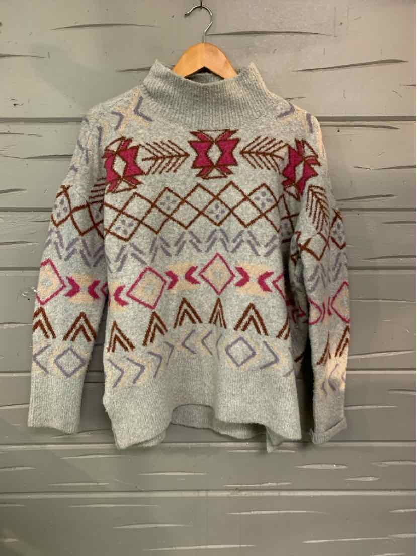 Light gray knit sweater with multicolor geometric and diamond patterns, turtleneck, long sleeves, relaxed fit.